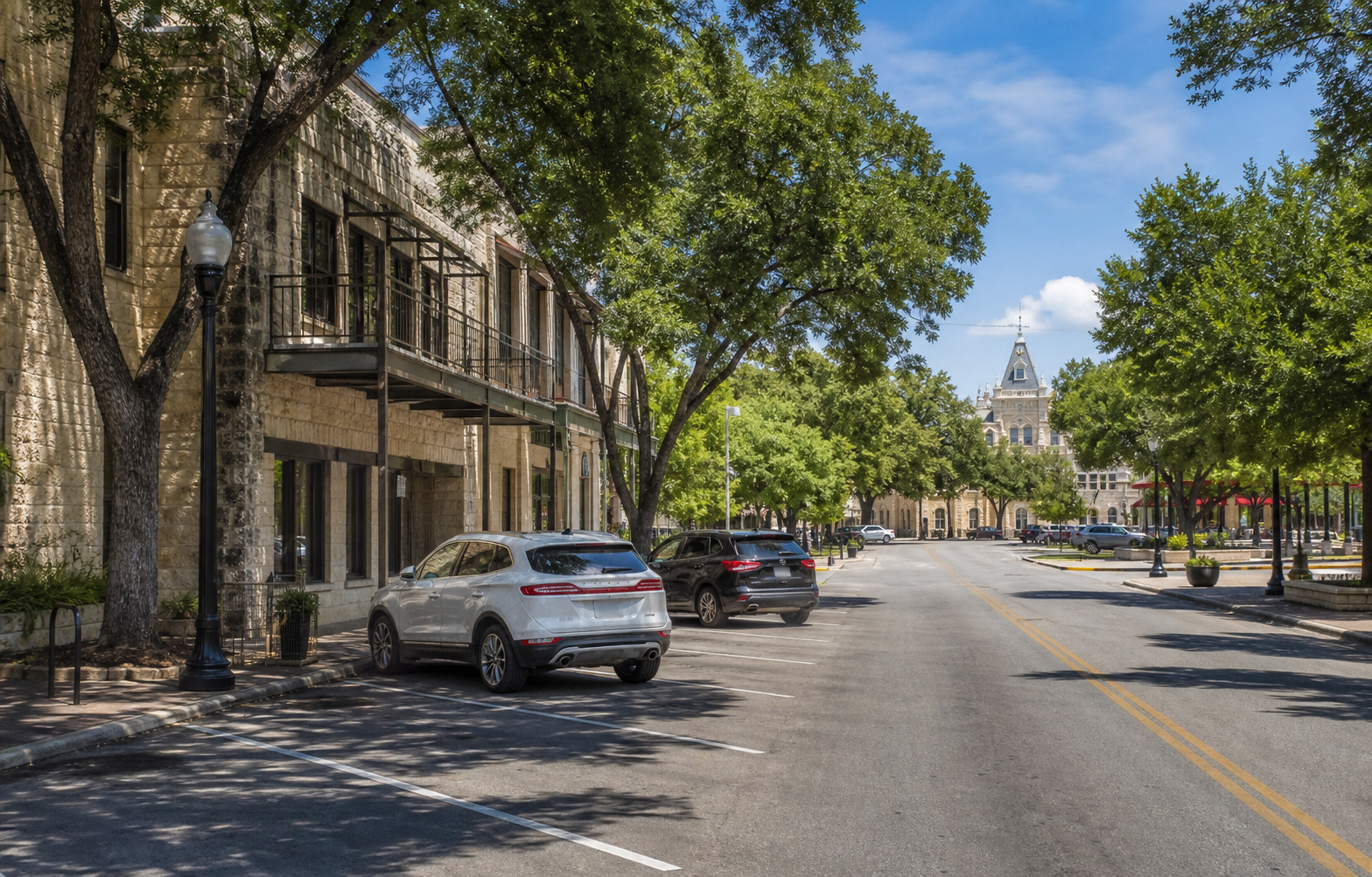Historic downtown New Braunfels street with public parking near Main Plaza